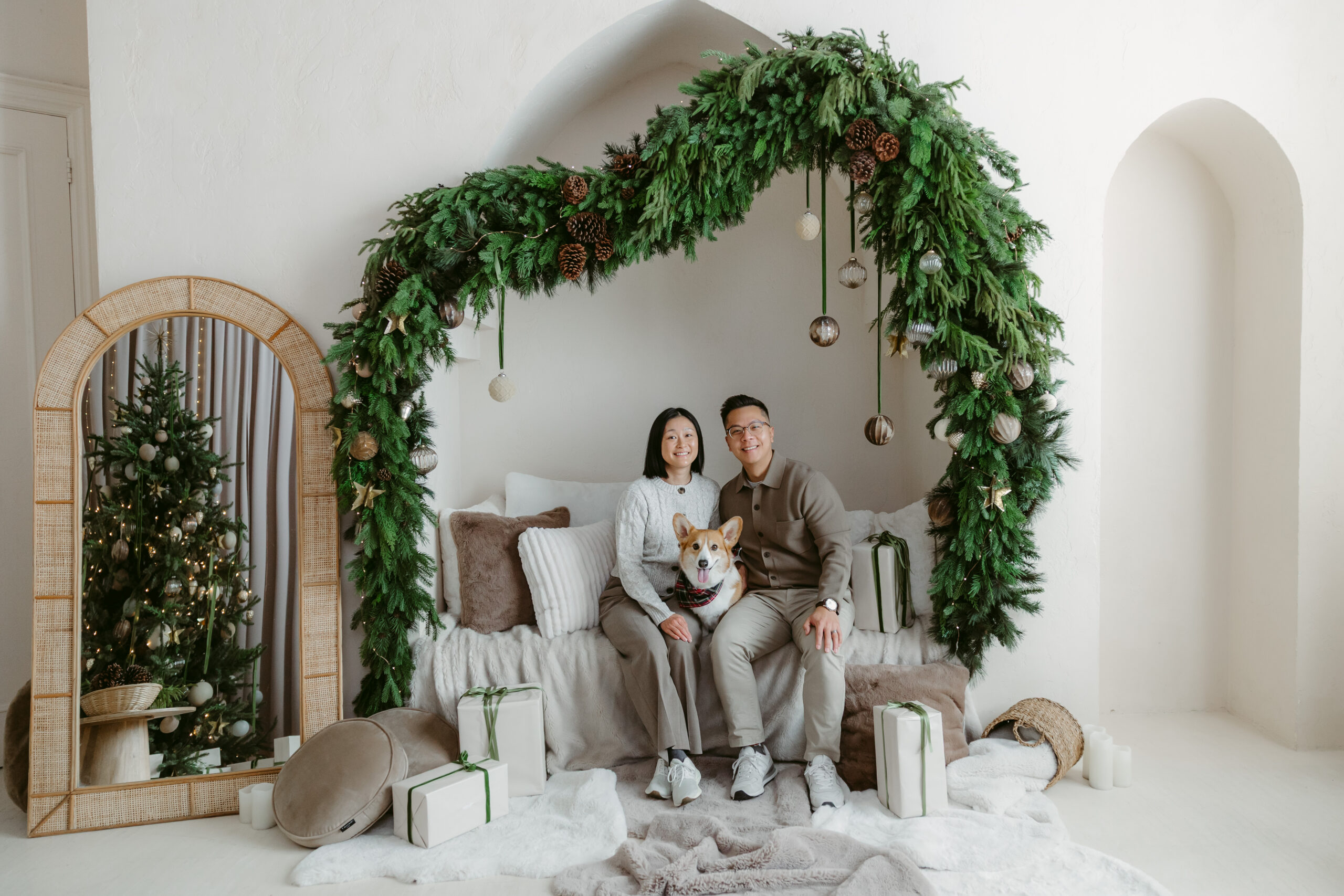 Couple with their corgi at the Mint Room Holiday Photo Studio.